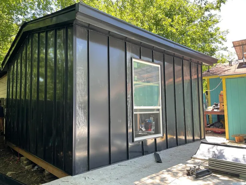 Black standing seam metal wall panels for Roof Inspection in Lealman